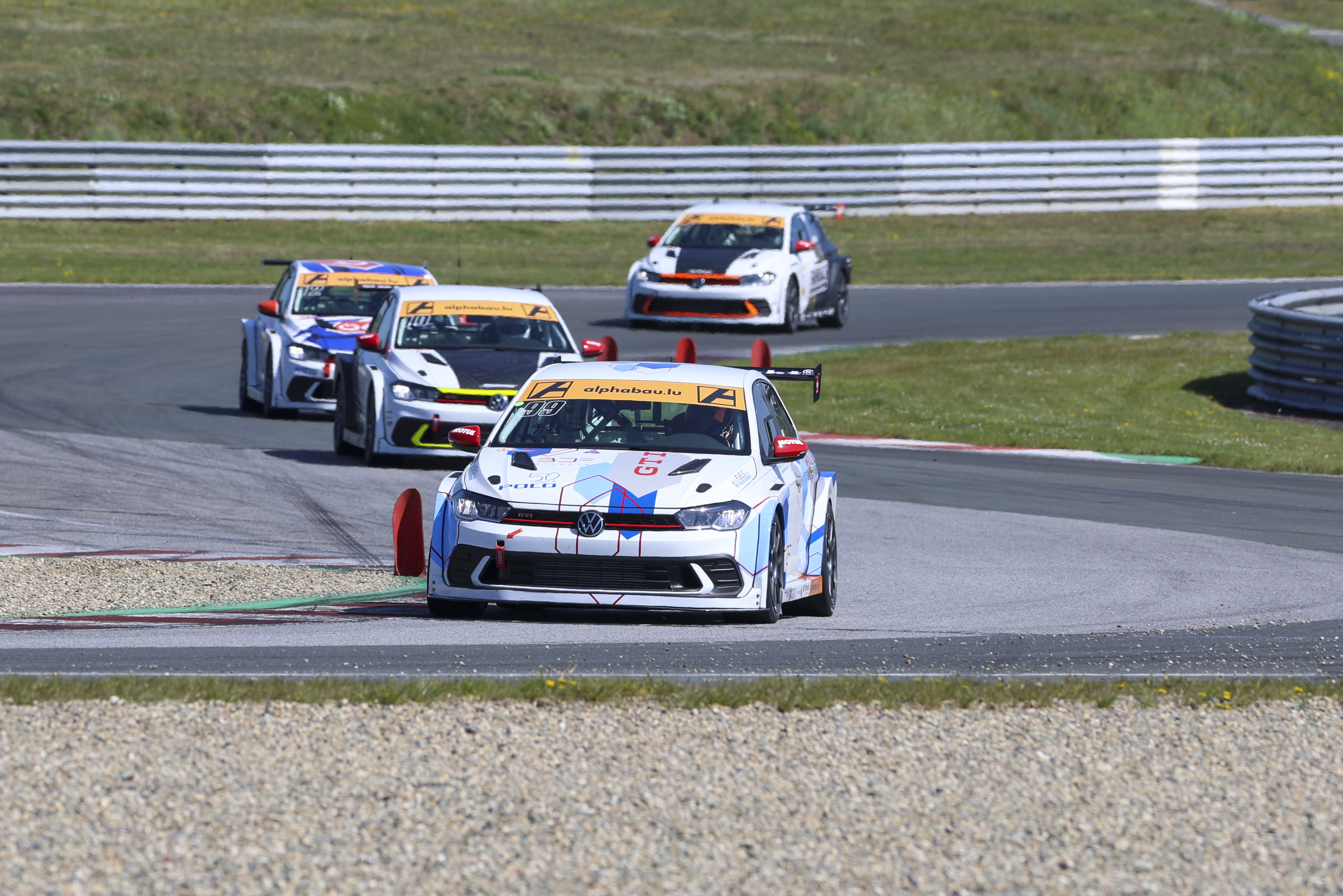 Polo Cup cars racing closely on circuit